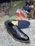 Black leather lace-up shoe